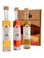 Preview: 3 Flaschen Rose Valley Likör vor der Verpackung stehend