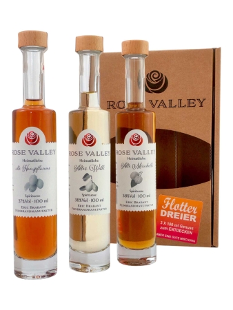 3 Flaschen 100ml Rose Valley vor der Verpackung stehend