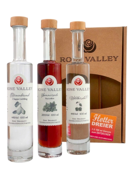 3 Flaschen 100ml Rose Valley vor der Verpackung stehend